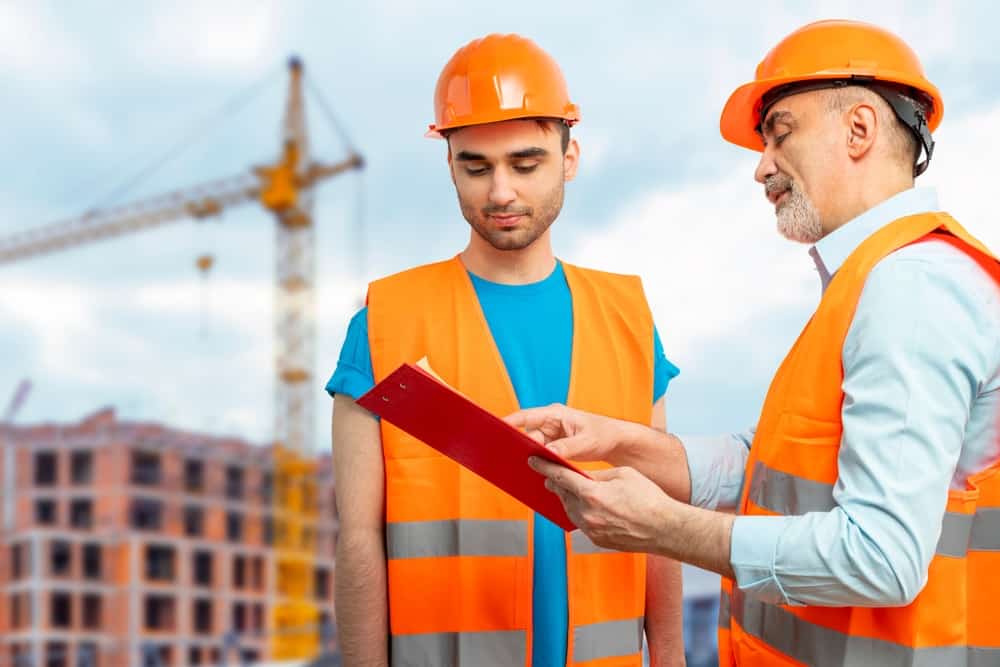 Older Construction Supervisor With Younger Worker