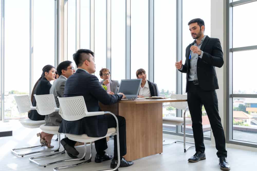 Discussing Together In Conference Room