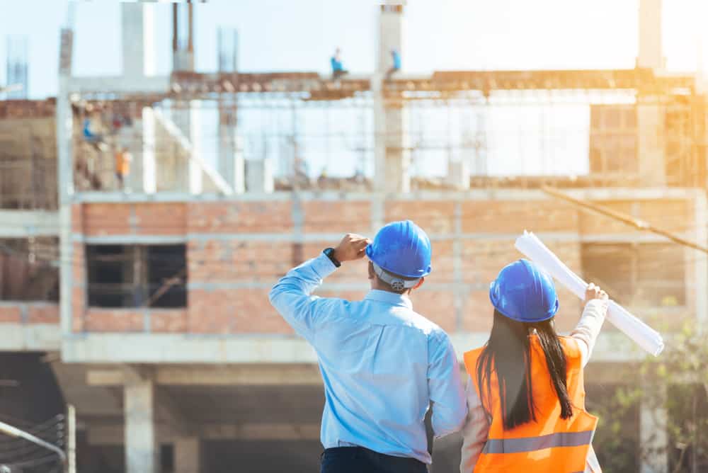 Asian Man Civil Engineer And Woman Architect